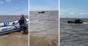 Dos hombres se metieron al Río de la Plata con una camioneta, terminaron encajados y los tapó el agua