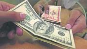Dólar paralelo baja y se acera a los Bs 12, en medio una coyuntura política cambiante
