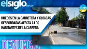 Huecos en la carretera y cloacas desbordadas afecta a los habitantes de La Cabrera