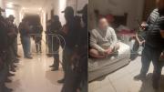 Le cobran por la habitación en un hotel y él en respuesta pone un arma de fuego sobre la mesa